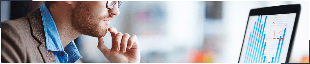 An image of a man analysing market trends to ensure CX continuity.