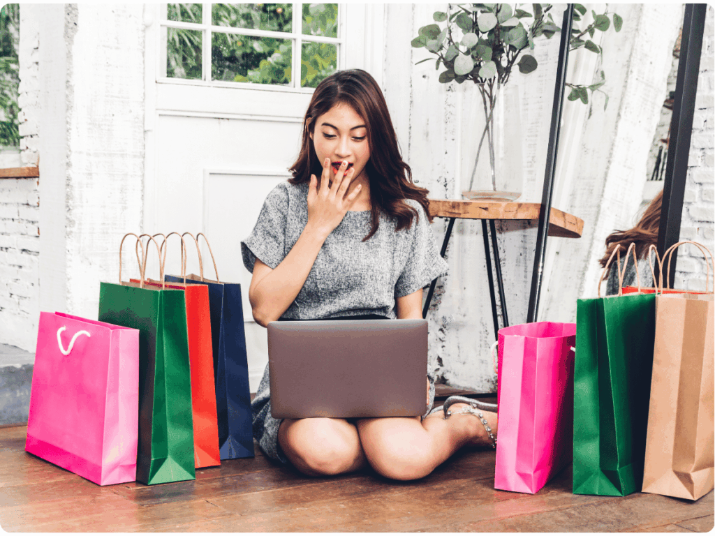 A picture of a happy consumer satisfied with her online shopping journey.