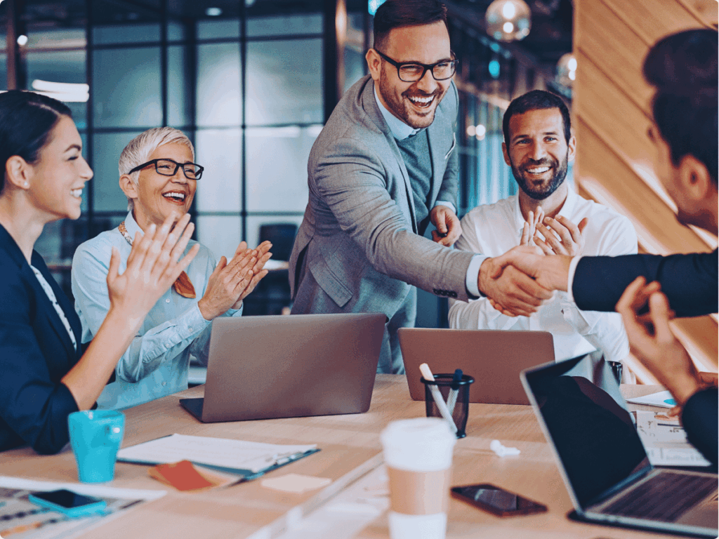 A picture presenting business meeting where the teams analyse content moderation best practices.