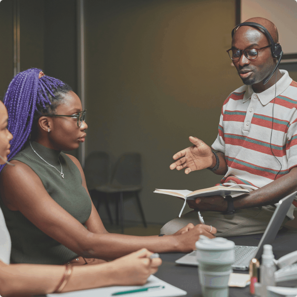 A picture illustrating the outsourcing team work on the processes.