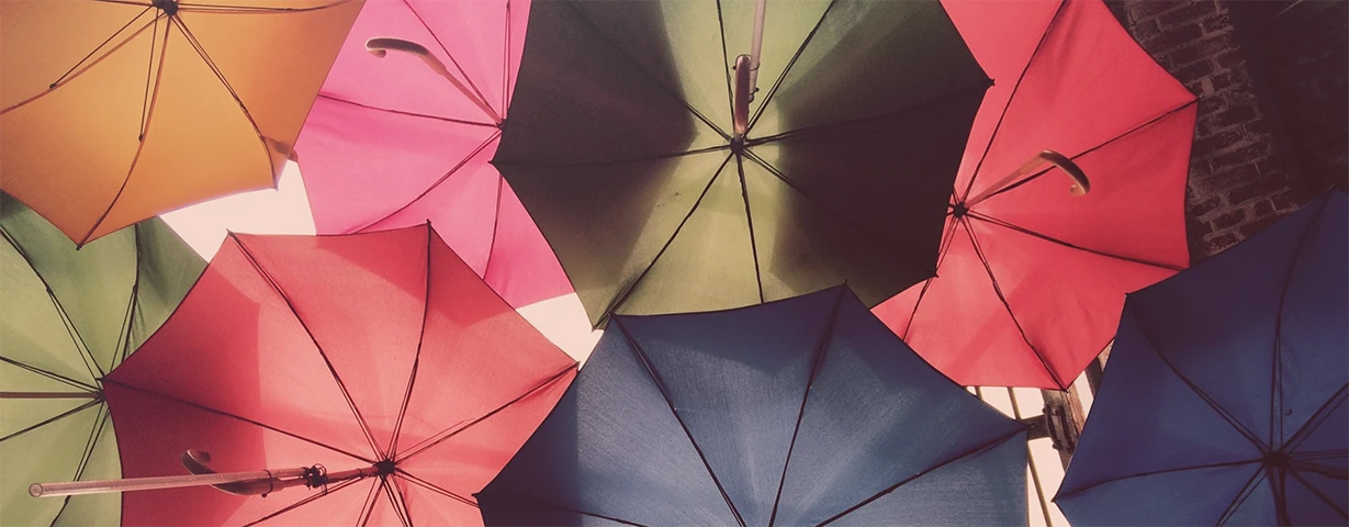 Colourful umbrellas that symbolise protection and safety.