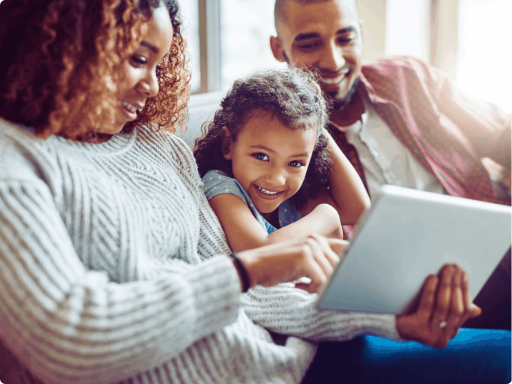 A picture of a happy family enjoying safety online usage.