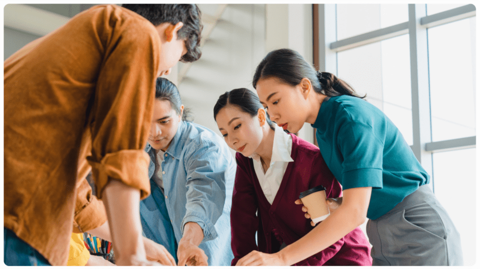 A picture of a CX team working to emower the philippines customer service outsourcing.